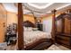 Spacious main bedroom featuring a four-poster bed, carpeted floors and neutral walls at 126 Amberwood Ln, Euharlee, GA 30145