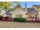 A nice backyard view with a deck or patio featuring green grass and mature landscaping at 3 S Riversong Ln, Alpharetta, GA 30022