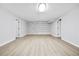 Finished basement with stylish accent wall and durable floors, ready for flexible use and entertainment at 3 S Riversong Ln, Alpharetta, GA 30022