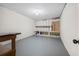 Unfinished basement with concrete floor, open shelving and potential for customization at 3 S Riversong Ln, Alpharetta, GA 30022