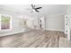 Open concept living room featuring new flooring, neutral walls, and an open layout great for entertaining at 3 S Riversong Ln, Alpharetta, GA 30022