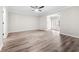 Spacious living room showcasing modern wood-look flooring, neutral paint and natural light at 3 S Riversong Ln, Alpharetta, GA 30022