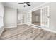 Bright office space with new floors, neutral paint, and glass French doors leading to living areas at 3 S Riversong Ln, Alpharetta, GA 30022