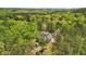 An aerial view of the home featuring mature trees and lush landscaping for exceptional privacy at 45 Harvey Ave, Covington, GA 30016
