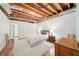 Finished basement bedroom showcasing wooden floor and exposed ductwork, with a full bath at 45 Harvey Ave, Covington, GA 30016