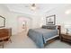 Cozy bedroom with a trey ceiling, neutral color scheme, carpet, and ample sunlight at 45 Harvey Ave, Covington, GA 30016