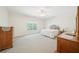 Spacious bedroom featuring soft carpet, natural light, and traditional wooden furniture at 45 Harvey Ave, Covington, GA 30016