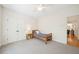 Bright bedroom with a bed, ceiling fan, and a large window offering abundant natural light at 45 Harvey Ave, Covington, GA 30016
