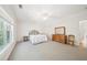 Spacious bedroom featuring soft carpet, natural light, and traditional wooden furniture at 45 Harvey Ave, Covington, GA 30016