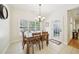 Bright dining area with a table and chairs and backyard access at 45 Harvey Ave, Covington, GA 30016