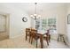 Dining area with table, chairs, tile floor, and views of the outdoor deck at 45 Harvey Ave, Covington, GA 30016