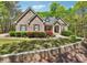 Charming brick home featuring a well-manicured lawn and mature landscaping at 45 Harvey Ave, Covington, GA 30016