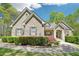 Charming brick home featuring a well-manicured lawn and mature landscaping at 45 Harvey Ave, Covington, GA 30016