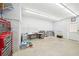 Spacious garage with shelving, offering ample storage space for tools, equipment, and other household items at 45 Harvey Ave, Covington, GA 30016