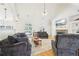 Spacious living room with stone fireplace, hardwood floors, and vaulted ceiling at 45 Harvey Ave, Covington, GA 30016