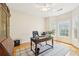 Comfortable office space with a ceiling fan, hardwood floors, natural light, and storage at 45 Harvey Ave, Covington, GA 30016