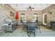 Outdoor patio with brick walls, ceiling fan, grill, and dining table, perfect for entertaining at 45 Harvey Ave, Covington, GA 30016