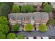 Aerial shot of brick townhomes surrounded by trees and parking at 4880 Payson Se Ter, Atlanta, GA 30339