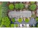 Aerial view of townhome community with mature trees and well-maintained landscaping at 4880 Payson Se Ter, Atlanta, GA 30339