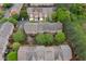 Aerial view of residential townhomes featuring decks and mature trees at 4880 Payson Se Ter, Atlanta, GA 30339