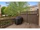 Exterior view of a charming wooden back deck with a fence and a grill at 4880 Payson Se Ter, Atlanta, GA 30339