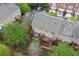 Aerial view showcasing decks and patios of backyards, nestled amidst beautiful green foliage and trees at 4880 Payson Se Ter, Atlanta, GA 30339