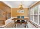 Traditional dining room with table, bench seating, chandelier, and staircase at 4880 Payson Se Ter, Atlanta, GA 30339