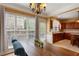 Traditional dining room connected to the kitchen with table, chairs, and lots of natural light at 4880 Payson Se Ter, Atlanta, GA 30339