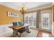 Traditional dining room with table, bench seating, chandelier, and plenty of natural light at 4880 Payson Se Ter, Atlanta, GA 30339