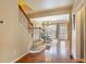Welcoming entryway with hardwood floors, stairs, and dining area with plenty of natural light at 4880 Payson Se Ter, Atlanta, GA 30339