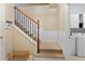 Hallway with stairs and view into the laundry room at 4880 Payson Se Ter, Atlanta, GA 30339