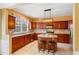 Lovely kitchen featuring stainless steel appliances, dark wood cabinets, and a functional kitchen island at 4880 Payson Se Ter, Atlanta, GA 30339