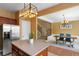 Modern kitchen with stainless steel appliances and view of the dining area and staircase at 4880 Payson Se Ter, Atlanta, GA 30339