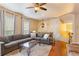 Spacious living room with hardwood floors, comfortable seating, a ceiling fan, and plenty of natural light at 4880 Payson Se Ter, Atlanta, GA 30339