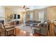 Inviting living room featuring hardwood floors, a fireplace with a decorative mantel, and comfortable seating at 4880 Payson Se Ter, Atlanta, GA 30339