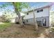 Back exterior view of home showcasing a deck, sliding door, and outdoor access at 6497 King William Dr, Morrow, GA 30260