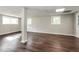 Basement featuring hardwood floors, recessed lighting, painted walls, and two windows at 6497 King William Dr, Morrow, GA 30260