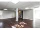 Spacious basement featuring hardwood floors, recessed lighting, and painted walls at 6497 King William Dr, Morrow, GA 30260