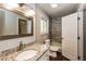 Updated bathroom with granite vanity, a large mirror, and a modern shower with tile surround at 6497 King William Dr, Morrow, GA 30260