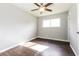 Bedroom with hardwood floors, a ceiling fan, one window, and neutral colored walls at 6497 King William Dr, Morrow, GA 30260