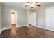 A spacious bedroom features hardwood floors, a ceiling fan, and multiple closets at 6497 King William Dr, Morrow, GA 30260