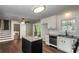 Updated kitchen with white cabinets, granite countertops, stainless steel appliances, and island at 6497 King William Dr, Morrow, GA 30260