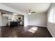 Open-concept living room with hardwood floors connects seamlessly to a modern kitchen at 6497 King William Dr, Morrow, GA 30260