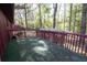 Decking area surrounded by lush greenery and trees, perfect for outdoor enjoyment at 125 Valley View Ct, Tyrone, GA 30290