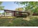Well-maintained backyard featuring a fenced area, porch, and verdant lawn at 125 Valley View Ct, Tyrone, GA 30290