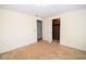 Bright bedroom with carpeted floors and a closet space, providing a simple and comfortable living area at 125 Valley View Ct, Tyrone, GA 30290