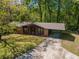 Charming home with a covered carport, brick accents, and a well-manicured lawn at 125 Valley View Ct, Tyrone, GA 30290