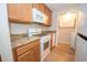 Bright kitchen with white appliances and plenty of cabinet space for storage at 125 Valley View Ct, Tyrone, GA 30290