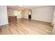 Open concept living room with hardwood floors and access to the back deck at 125 Valley View Ct, Tyrone, GA 30290