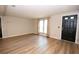Inviting living room featuring hardwood floors, fresh paint, and lots of light at 125 Valley View Ct, Tyrone, GA 30290